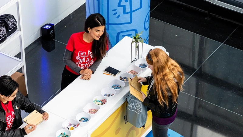 Image of a merch table giving away swag